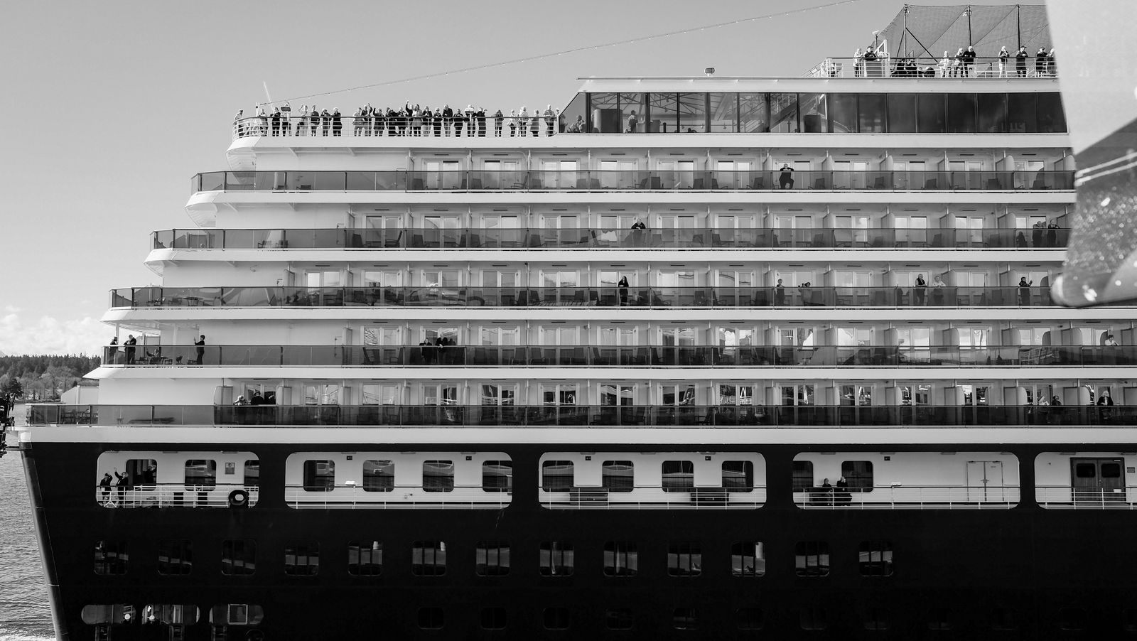 Tiers of cabins and balconies on a large ship, typical of Carnival cruise ship classes