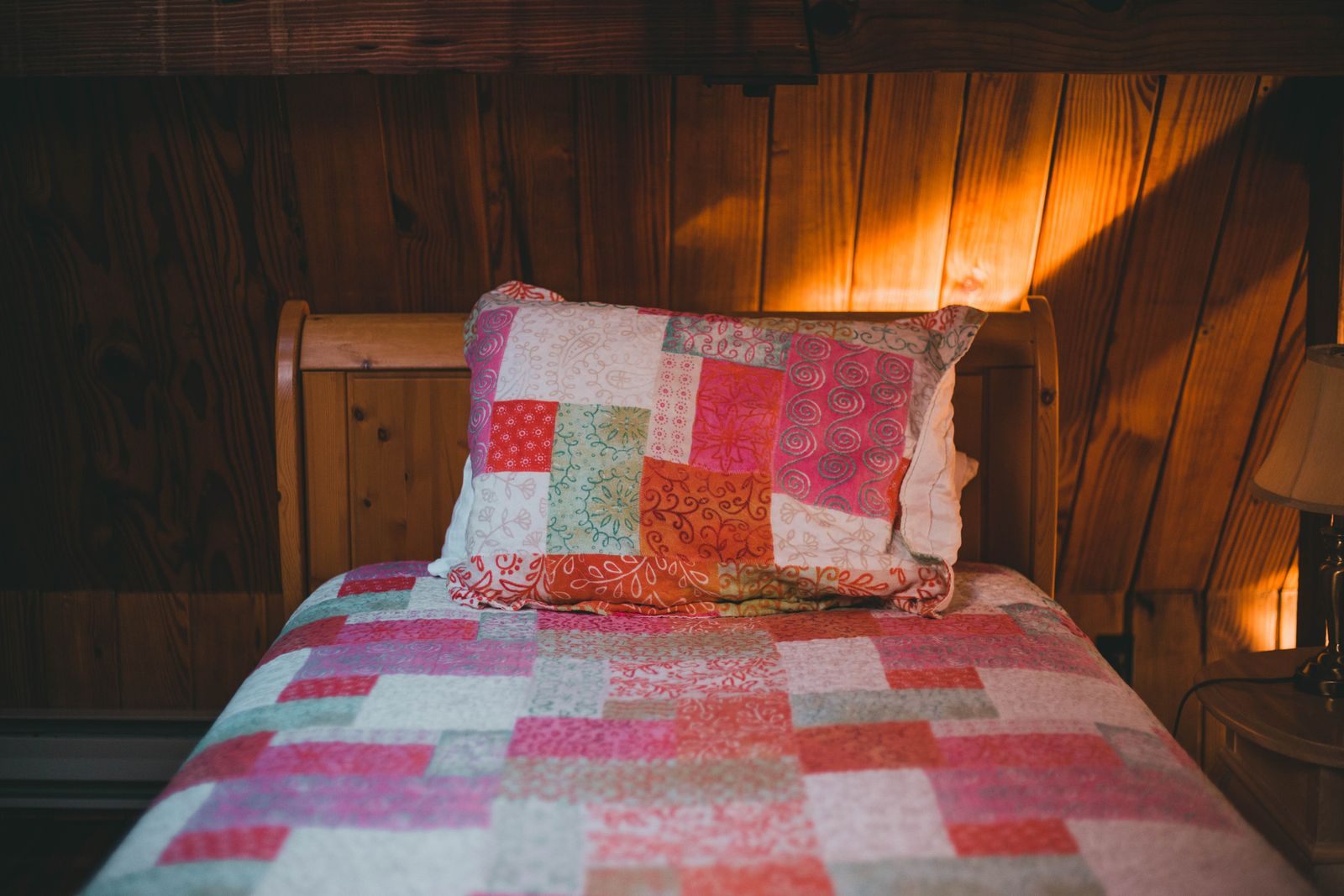Made-up bed in a cozy cabin, the product behind cruise category codes