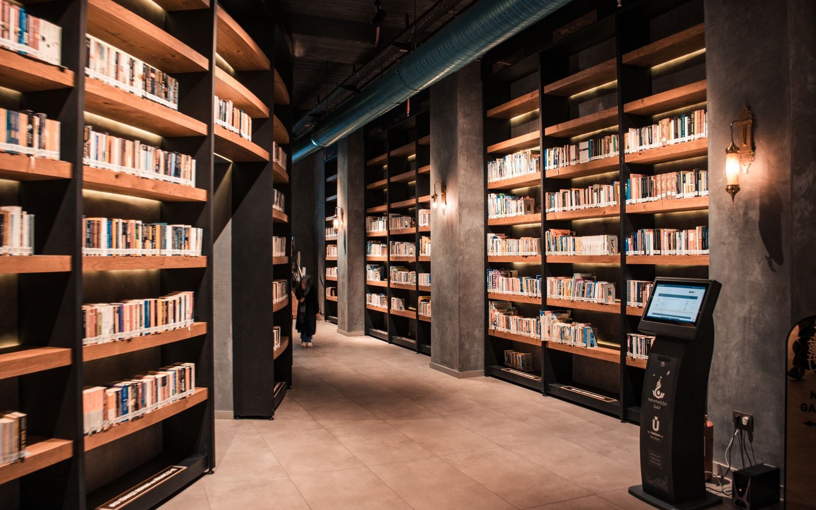 Library with tall bookshelves, a nod to building cruise product knowledge