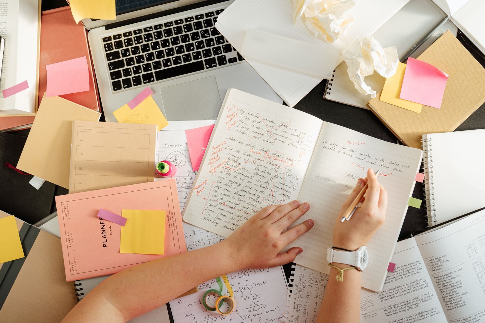 Desk with notes and a planner, used to compare cruise fare types and deadlines