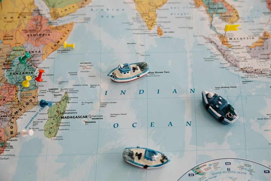 Toy boats placed on a world map