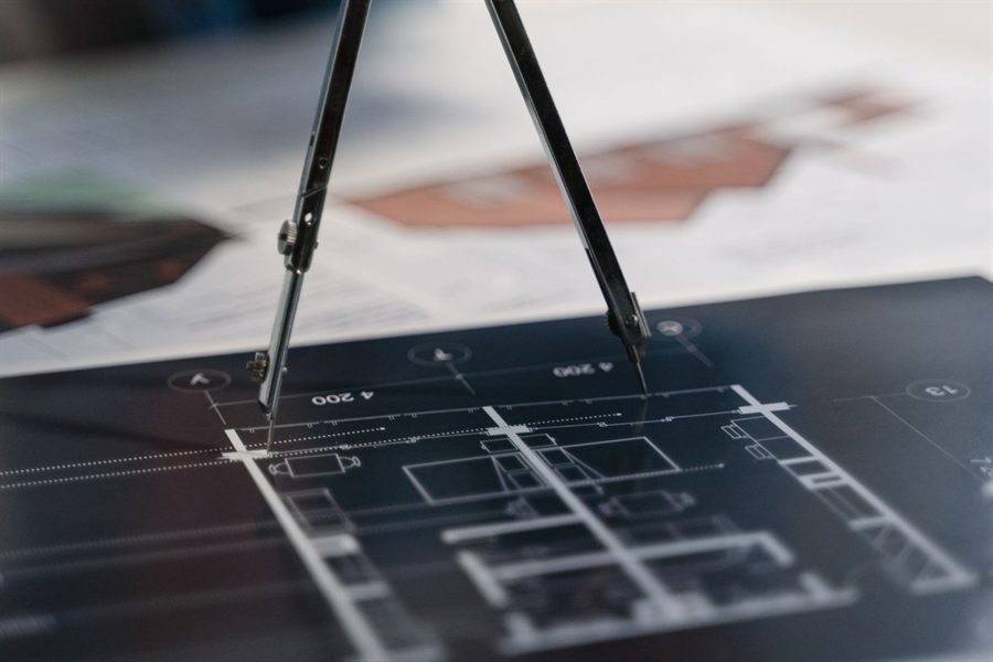 Drafting compass on a technical drawing